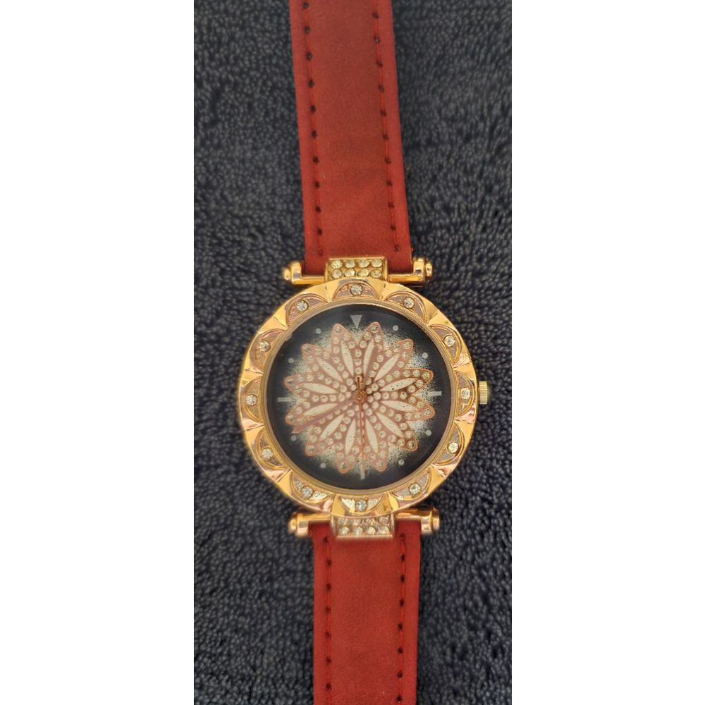 Gold toned watch with rhinestones